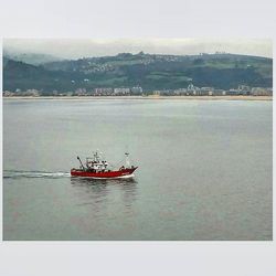 Boats sailing in sea