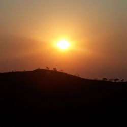 Scenic view of silhouette landscape against sky during sunset