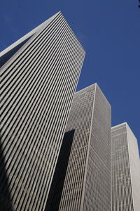 Low angle view of modern buildings against clear sky