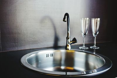 Close-up of wine glass on table at home