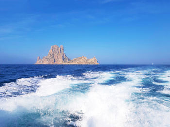 Naturalistic maritime panorama of es vedra in the sea of ibiza from cala d'hort in balearic islands