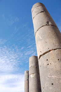 Low angle view of smoke stack against sky