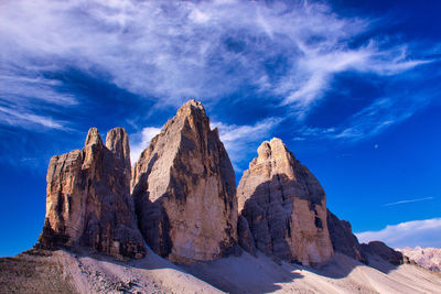 Panoramic view of mountains against blue sky