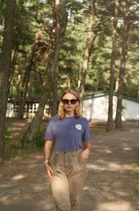 Portrait of young woman standing outdoors