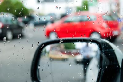 Water drops on car window during rainy season