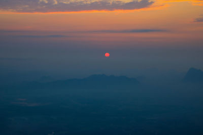 Scenic view of silhouette mountain against sky during sunset