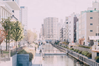 High angle view of river amidst buildings in city