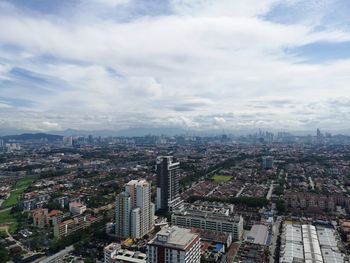 High angle view of buildings in city against sky