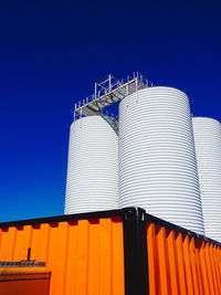 Low angle view of built structure against clear blue sky