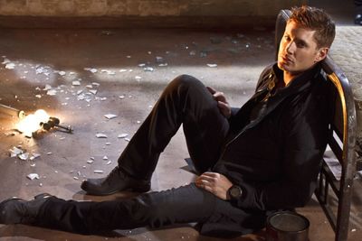 High angle portrait of young man sitting in abandoned room