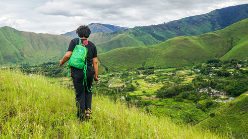 Full length of man on landscape against sky