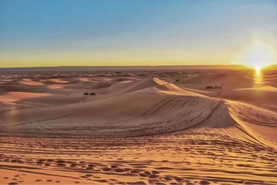 Aerial view of desert against clear sky