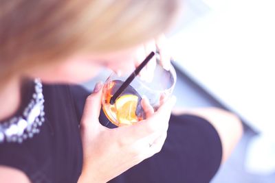 Close-up of woman holding a glass