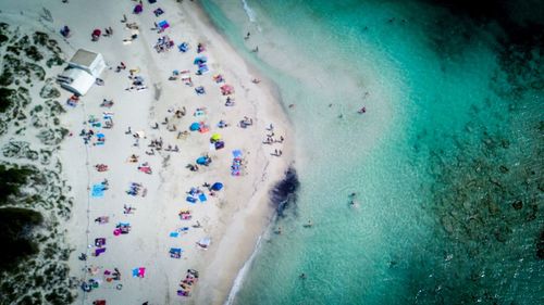 High angle view of multi colored umbrellas in water