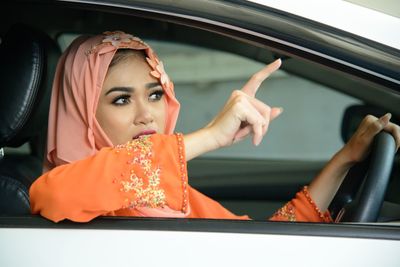 Portrait of woman in car