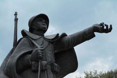 Low angle view of statue against sky