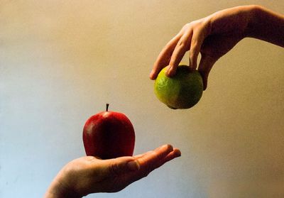 Close-up of hand holding apple