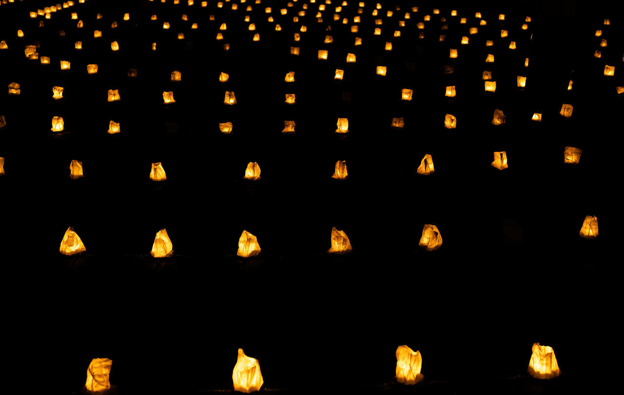 font, large group of objects, illuminated, no people, lighting equipment, in a row, night, abundance, tradition, yellow, circle