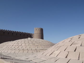 Low angle view of historic building against clear blue sky