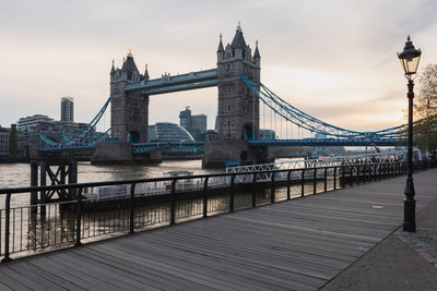 Bridge over river with buildings in background