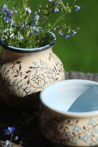 Close-up of ceramic cap and ceramic vase