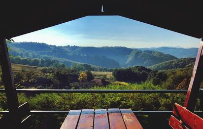 Scenic view of landscape seen through window