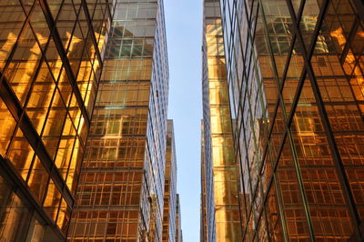 Low angle view of tall building against clear sky