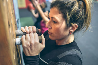 High angle view of woman exercising in gym