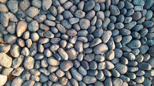 Full frame shot of pebbles on beach