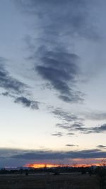 Scenic view of landscape against cloudy sky