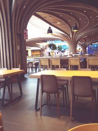 Empty chairs and tables in cafe