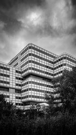 Low angle view of ibm nederland building by lucas and niemeijer against sky