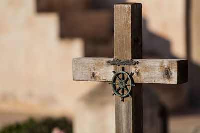 Close-up of cross in cemetery