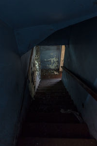 Staircase in illuminated tunnel