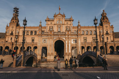 Group of people in front of historical building