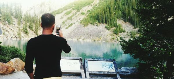 Man looking at lake