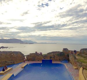 Scenic view of sea against cloudy sky