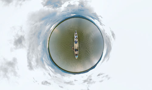 Digital composite image of man and sunglasses against sky in winter