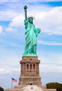 Low angle view of statue against cloudy sky