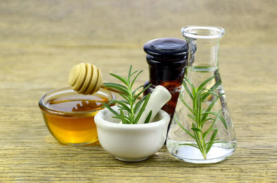 Honey, rosemary and essential oil for homeopathy remedy.