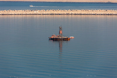 Ship in sea against sky