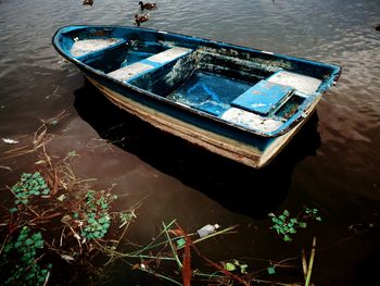 High angle view of abandoned boat moored on beach