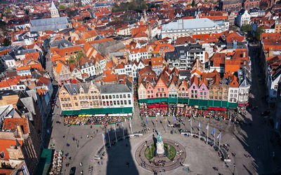 High angle view of crowd at city square during sunny day