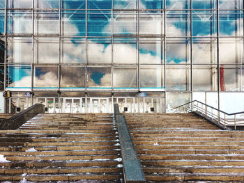 Staircase of building in city against sky