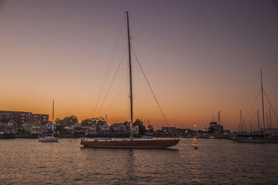 Sailboat in river at sunset