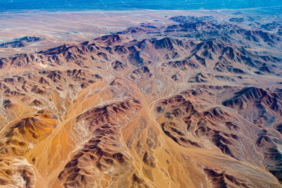 Aerial view of dry rivers and mountains in the altiplano of the atacama desert, chile.