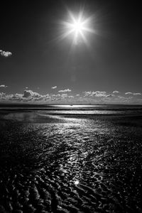 Scenic view of sea against sky on sunny day