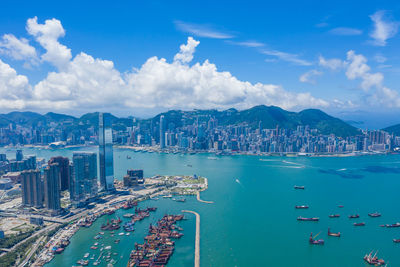 Panoramic view of sea and buildings against sky