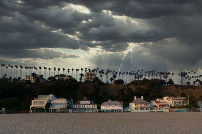 View of venice beach with houses and street in santa monica during storm and thunders