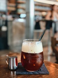 Close-up of beer glass on table